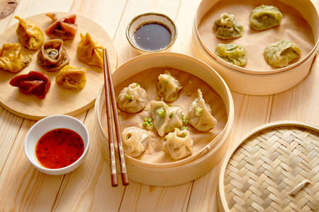 Traditional chinese dumplings served in the wooden bamboo steamerの写真素材