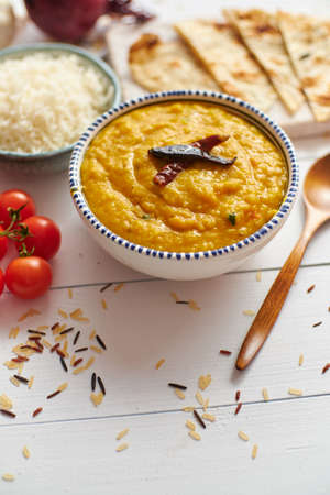 Indian popular food Dal fry or traditional Dal Tadka Curry served in bowlの写真素材