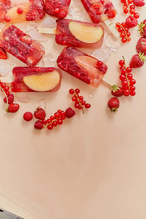 Homemade frozen various red berries natural juice ice cream- paletas - ice popsの写真素材