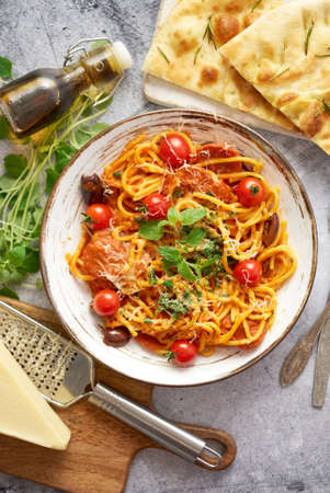 Tasty appetizing pasta served with tomato sauceの写真素材