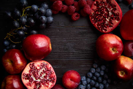 Mix of fresh red and black fruits. With botteled fresh juicesの写真素材