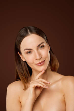 Sensual naked woman with perfect skin looking at cameraの写真素材