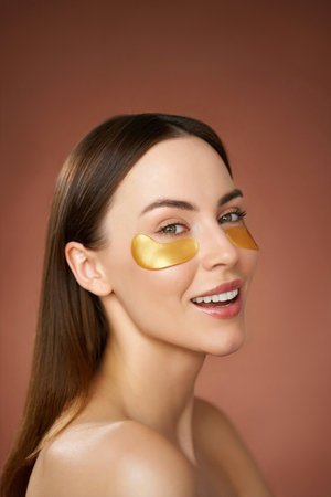 Smiling woman with eye patchesの写真素材