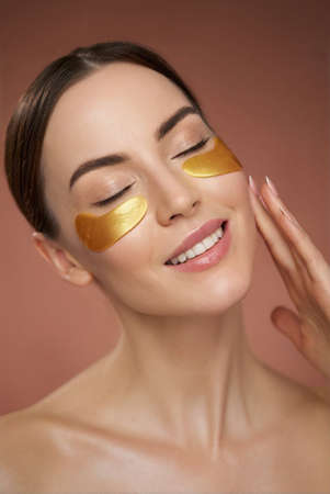 Young woman with eye patchesの写真素材