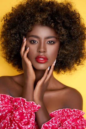 Black woman with makeup in studioの写真素材