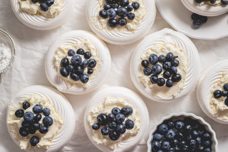 Homemade delicious mini Pavlova meringue made of fresh berries and mascarponeの写真素材