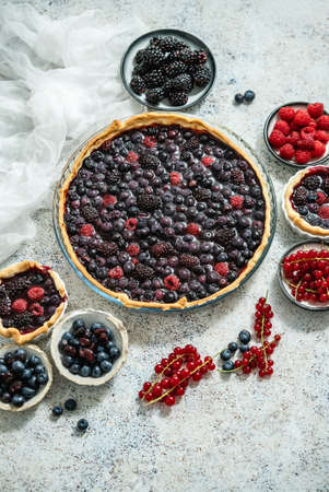 Sweet delicious homemade forest berry tart. Pie with blueberries and raspberries.の写真素材