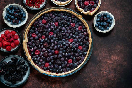 Homemade fresh round cake tart with berries, raspberries, blackberriesの写真素材