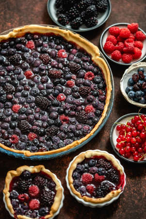 Homemade fresh round cake tart with berries, raspberries, blackberriesの写真素材