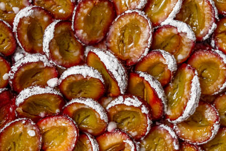 Tasty homemade pie or tart with plums and sugar powder. Close up shotの写真素材