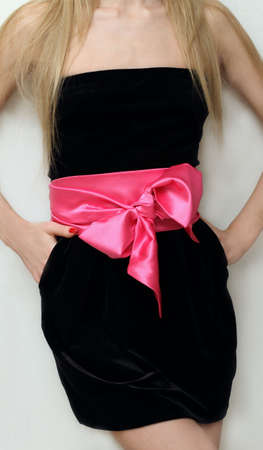 Girl in black dress with pink bowの写真素材