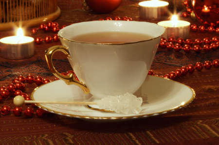 Christmas still life with candles, balls and tea の写真素材