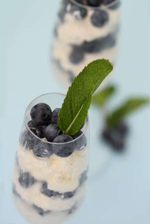 Dessert with a blueberries and whipped creamの写真素材