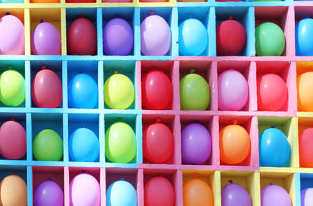 Bright colored balloons in the wooden boxesの写真素材