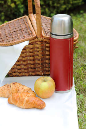 Outdoor picnic setting with hot flaskの写真素材