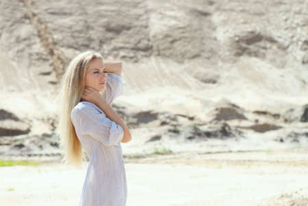 Beautiful blond girl in the sunny dayの写真素材