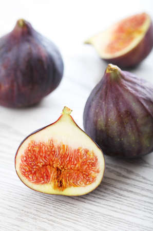 Fresh figs on the white wooden backgroundの写真素材