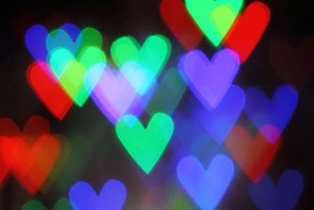 Blurred valentine background with heart shaped lightsの写真素材