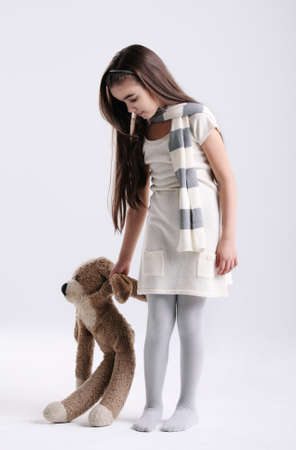 Little girl with toy in the studioの写真素材