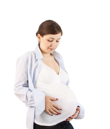 Happy pregnant woman touching her bellyの写真素材