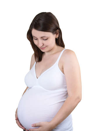 Happy pregnant woman touching her bellyの写真素材
