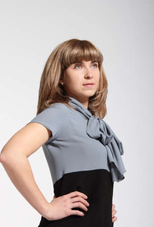 Young business woman in grey and black dressの写真素材