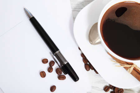 Coffee  and letters with pen on the tableの写真素材