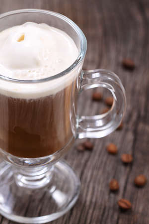 Ice cream coffee and coffee beans on the wooden background