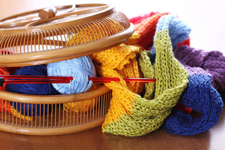 Wooden basket with multi color knitting. Close upの写真素材