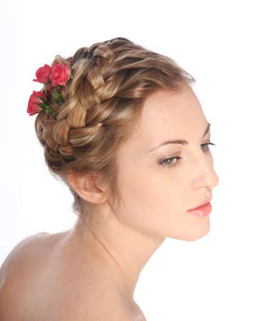 Portrait of the beauty young blond girl with roses in her hairの写真素材