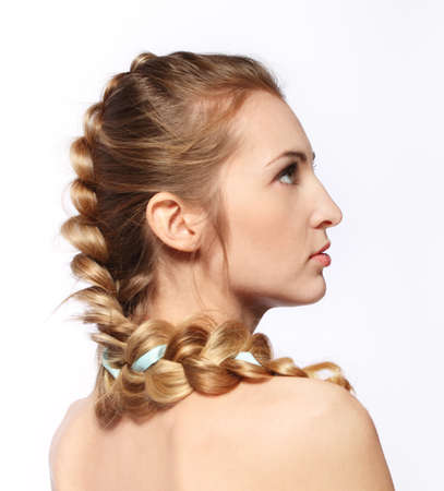 Portrait of the beauty young blond girl with hairdressの写真素材