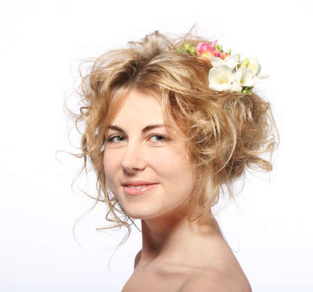 Portrait of the beauty young blond girl with freesiaの写真素材