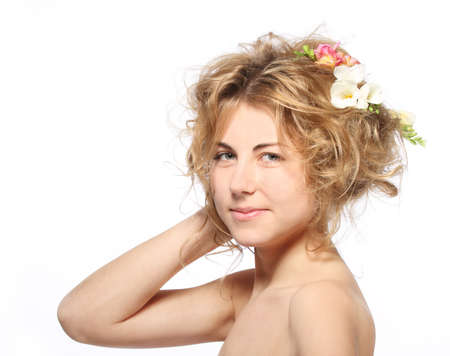 Portrait of the beauty young blond girl with freesia in her hairの写真素材