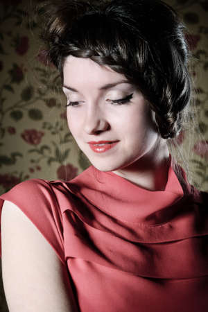 Portrait of the beautiful stylish brunette woman in red dress