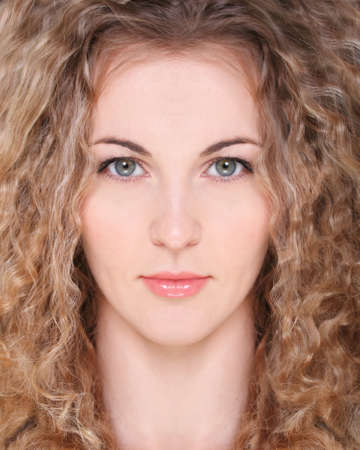 Portrait of the beauty young blond girl with curly hairの写真素材