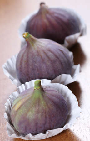 The fresh figs on the wooden backgroundの写真素材
