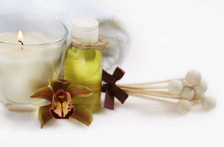 Spa setting with orchid, towel and aroma oilの写真素材