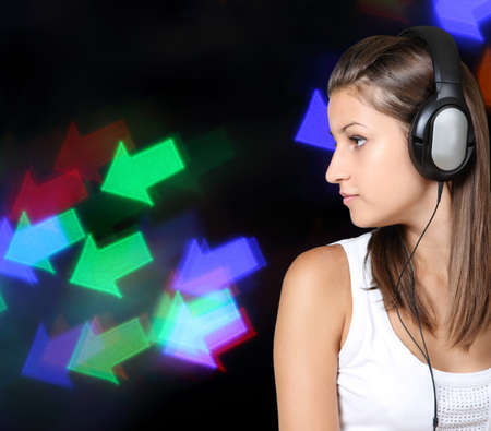 Portrait of the brunette beauty girl wearing headphonesの写真素材