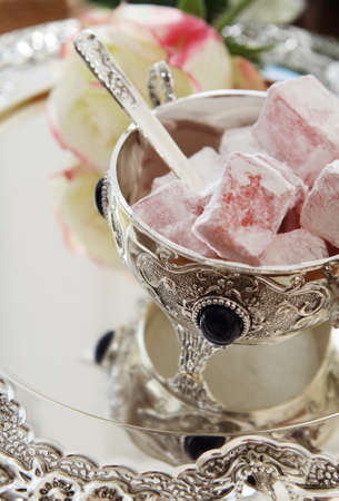 East sweets in silver ware with roseの写真素材