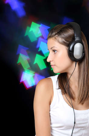 Portrait of the brunette beauty girl wearing headphonesの写真素材