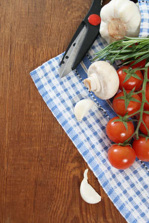 Vegetables still life with scissors on wooden backgroundの写真素材