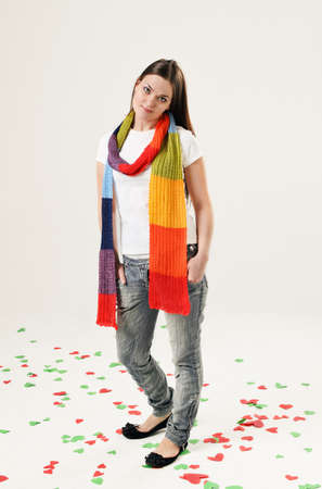 Beautiful girl wearing scarf on the background with heartsの写真素材
