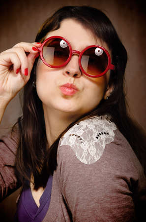 Funny young brunette woman in retro styleの写真素材