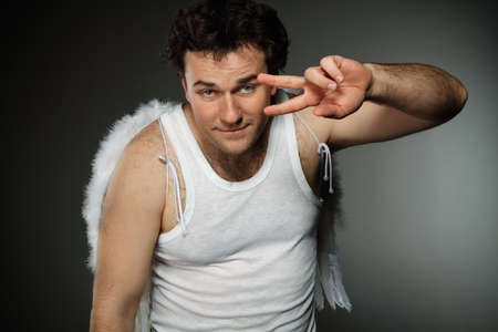 Mr. Angel with white wings. Crazy character portrait.の写真素材