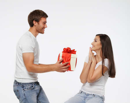 Couple celebrating a special date with a giftの写真素材