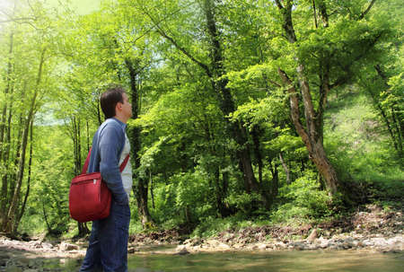Man enjoying the fresh air in green forestの写真素材