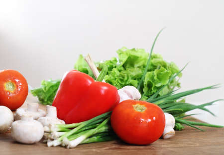 Fresh vegetables on the wooden background  at the kitchenの写真素材