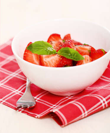Fresh strawberry salad with basil and pepperの写真素材