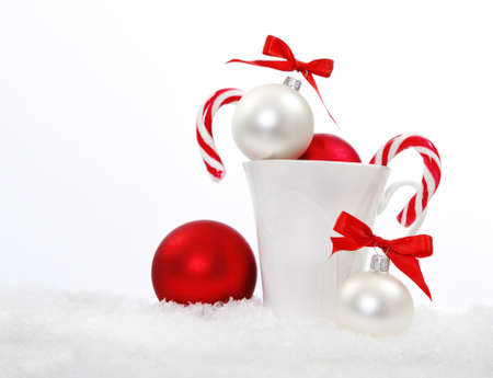 Christmas composition with candies and christmas decoration over whiteの写真素材