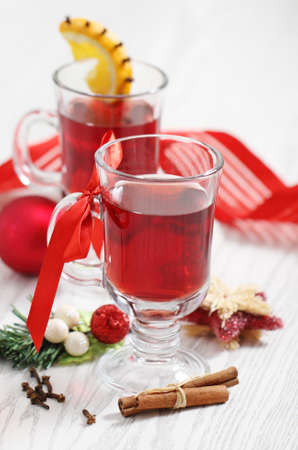 Cranberry punch with spices and Christmas decorationの写真素材